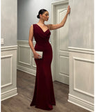 Turn heads at Prom 2025 in this wine prom dress, where statement-making details meet the iconic style of the Margot One-Shoulder Cowl Neck Mermaid Dress .