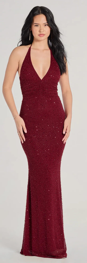 Turn heads at Prom 2025 in this wine prom dress, where statement-making details meet the iconic style of the Blake V-Neck Halter Beaded Slim Formal Dress .