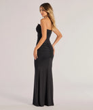 The Elowen Plunging V-Neck Ruched Mermaid Dress is a show-stopping black prom dress, offering a sleek, slimming silhouette that enhances your natural beauty for an unforgettable night.