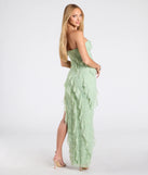 The Ellie Ruffled Lace High Slit Formal Dress in sage is a stunning green prom dress designed to capture attention with its fresh or bold color and effortlessly stylish silhouette.