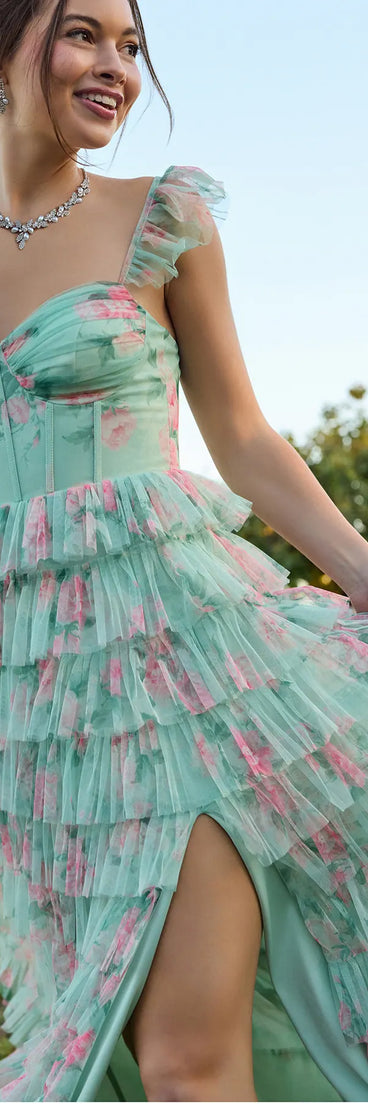 The Reyna Corset Slit A-Line Floral Formal Dress in sage is a stunning green prom dress designed to capture attention with its fresh or bold color and effortlessly stylish silhouette.