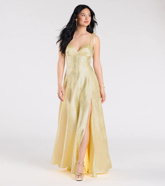 Turn heads at Prom 2025 in this yellow prom dress, where statement-making details meet the iconic style of the Melika Bustier Slit A-Line Satin Formal Dress.