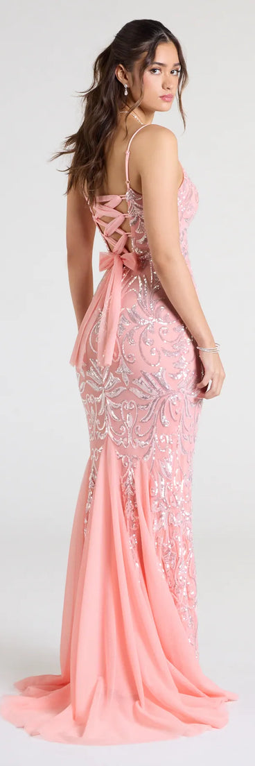 Turn heads at Prom 2025 in this coral prom dress, where statement-making details meet the iconic style of the Claire Lace-Up Sequin Mermaid Dress.