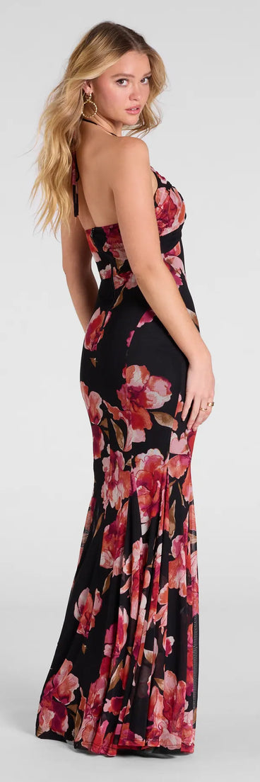 The Malia Halter Mermaid Floral Mesh Formal Dress is a show-stopping black prom dress, offering a sleek, slimming silhouette that enhances your natural beauty for an unforgettable night.