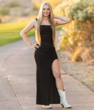 The Devon Glitter Cutout High Slit Column Dress is a show-stopping black prom dress, offering a sleek, slimming silhouette that enhances your natural beauty for an unforgettable night.