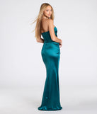 The Clea Satin Strapless Wrap Mermaid Dress in teal is a stunning green prom dress designed to capture attention with its fresh or bold color and effortlessly stylish silhouette.