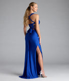 Turn heads at Prom 2025 in this royal blue prom dress, where statement-making details meet the iconic style of the Whitney Lace-Up Slit Formal Dress.