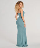 The Patricia Glitter Cowl Neck Column Dress in sage is a stunning green prom dress designed to capture attention with its fresh or bold color and effortlessly stylish silhouette.