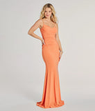 Step into Prom 2025 in a orange prom dress, where unique Windsor accents and the standout Patricia Cowl Neck Bodycon Glitter Formal Dress style come together.