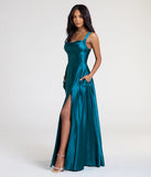 Turn heads at Prom 2025 in this teal prom dress, where statement-making details meet the iconic style of the Lelia Cowl Neck Slit A-Line Satin Formal Dress.