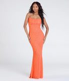 Turn heads at Prom 2025 in this orange prom dress, where statement-making details meet the iconic style of the Kerry Open Back Bodycon Pearl Bead Formal Dress.