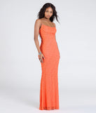 Turn heads at Prom 2025 in this orange prom dress, where statement-making details meet the iconic style of the Kerry Open Back Bodycon Pearl Bead Formal Dress.
