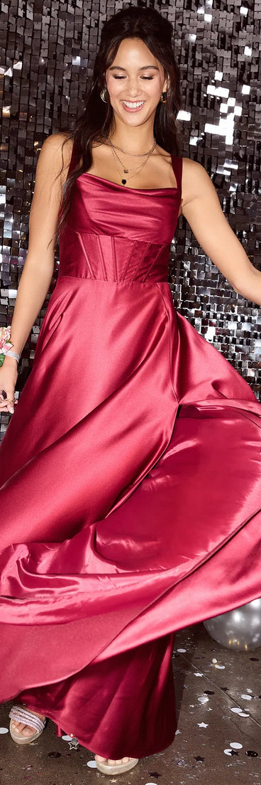 Turn heads at Prom 2025 in this burgundy prom dress, where statement-making details meet the iconic style of the Daphne Corset Slit A-Line Satin Formal Dress.