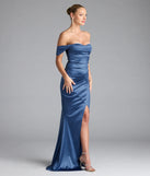 Turn heads at Prom 2025 in this denim blue prom dress, where statement-making details meet the iconic style of the Belinda Off-The-Shoulder Slit Satin Formal Dress.