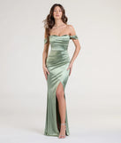 Turn heads at Prom 2025 in this sage green prom dress, where statement-making details meet the iconic style of the Belinda Off-The-Shoulder Slit Satin Formal Dress.