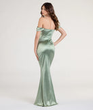 Turn heads at Prom 2025 in this sage green prom dress, where statement-making details meet the iconic style of the Belinda Off-The-Shoulder Slit Satin Formal Dress.
