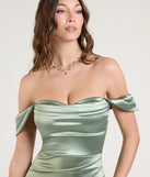 Turn heads at Prom 2025 in this sage green prom dress, where statement-making details meet the iconic style of the Belinda Off-The-Shoulder Slit Satin Formal Dress.