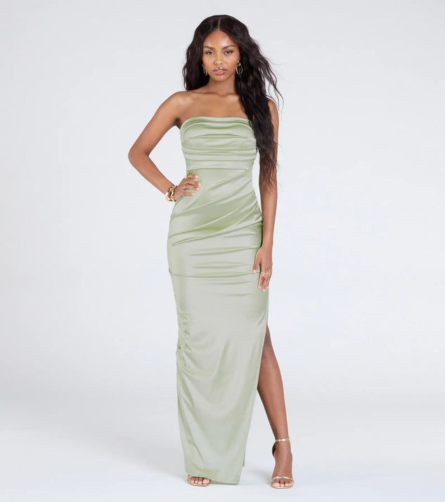 The Brianna Satin Strapless High Slit Column Dress in sage is a stunning green prom dress designed to capture attention with its fresh or bold color and effortlessly stylish silhouette.