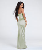 The Brianna Satin Strapless High Slit Column Dress in sage is a stunning green prom dress designed to capture attention with its fresh or bold color and effortlessly stylish silhouette.