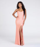 Turn heads at Prom 2025 in this peach prom dress, where statement-making details meet the iconic style of the Lizzie Lace-Up Cowl Back Slit Formal Dress.