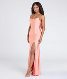 Turn heads at Prom 2025 in this peach prom dress, where statement-making details meet the iconic style of the Lizzie Lace-Up Cowl Back Slit Formal Dress.