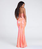 Make a bold statement in the Zoe Lace-Up Corset Mermaid Sequin Formal Dress in coral, the perfect spring dress for weddings, cocktail hours, nights out, and/or seasonal celebrations.