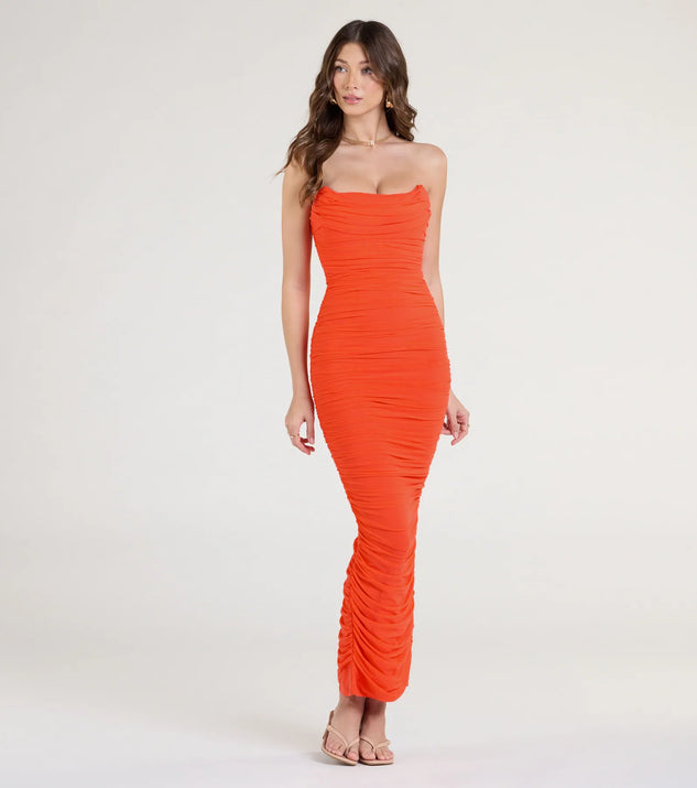 Turn heads at Prom 2025 in this orange prom dress, where statement-making details meet the iconic style of the Saisha Strapless Bodycon Mesh Formal Dress.