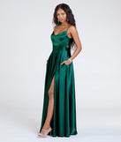 The Emilie Satin Tie-Back A-Line Formal Dress in hunter is a stunning green prom dress designed to capture attention with its fresh or bold color and effortlessly stylish silhouette.