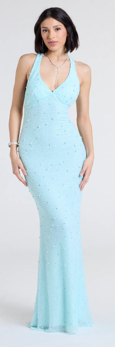 Own the spotlight in the Tyra Halter Open Back Pearl Mermaid Formal Dress, a light blue formal dress crafted to deliver luxe style for autumn weddings, Military Balls, or any special event.