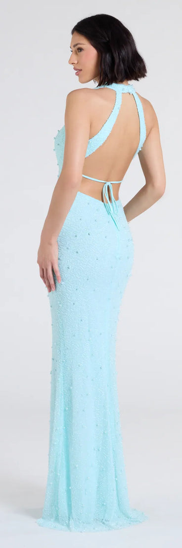 Turn heads at Prom 2025 in this light blue prom dress, where statement-making details meet the iconic style of the Tyra Halter Open Back Pearl Mermaid Formal Dress.