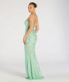 The Celina Sequin Lace-Up High Slit Mermaid Dress in sage is a stunning green prom dress designed to capture attention with its fresh or bold color and effortlessly stylish silhouette.