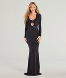 Turn heads at Prom 2025 in this black prom dress, where statement-making details meet the iconic style of the Kori Long Sleeve Plunge Cowl Neck Formal Dress .