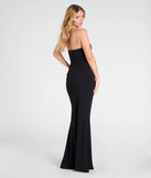 The Maude Strapless High Slit Mermaid Dress is a show-stopping black prom dress, offering a sleek, slimming silhouette that enhances your natural beauty for an unforgettable night.