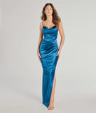 Turn heads at Prom 2025 in this teal prom dress, where statement-making details meet the iconic style of the Jane Cowl Neck Slit Satin Formal Dress .