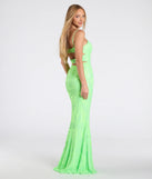 The Khloe Strappy Back Mermaid Sequin Formal Dress in lime is a stunning green prom dress designed to capture attention with its fresh or bold color and effortlessly stylish silhouette.