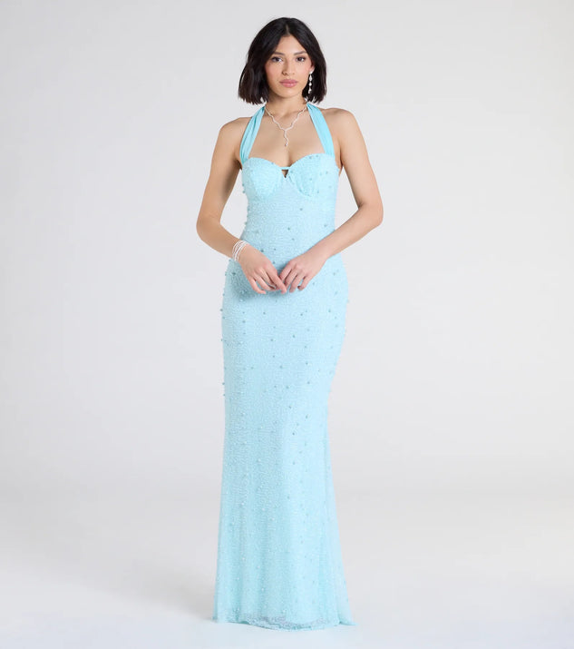 Turn heads at Prom 2025 in this light blue prom dress, where statement-making details meet the iconic style of the Calla Halter Mermaid Pearl Beaded Formal Dress.