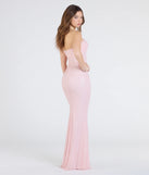 Turn heads at Prom 2025 in this pink prom dress, where statement-making details meet the iconic style of the Adrianna Strapless Mermaid Sequin Bead Formal Dress.