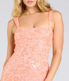 Make a bold statement in the Darlene Cutout Back Bodycon Sequin Formal Dress in coral, the perfect spring dress for weddings, cocktail hours, nights out, and/or seasonal celebrations.