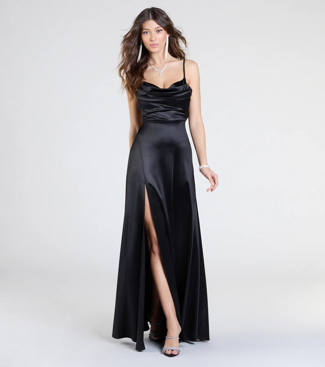 The Steffanie Tie Back Slit A-Line Satin Formal Dress is a show-stopping black prom dress, offering a sleek, slimming silhouette that enhances your natural beauty for an unforgettable night.