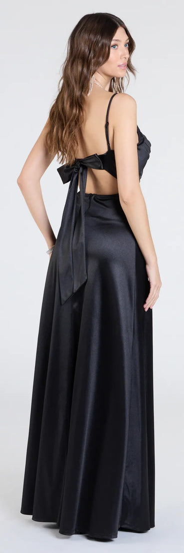 The Steffanie Tie Back Slit A-Line Satin Formal Dress is a show-stopping black prom dress, offering a sleek, slimming silhouette that enhances your natural beauty for an unforgettable night.