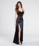 The Steffanie Tie Back Slit A-Line Satin Formal Dress is a show-stopping black prom dress, offering a sleek, slimming silhouette that enhances your natural beauty for an unforgettable night.