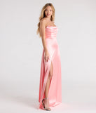 Turn heads at Prom 2025 in this coral prom dress, where statement-making details meet the iconic style of the Alison Strapless Slit A-Line Satin Formal Dress.