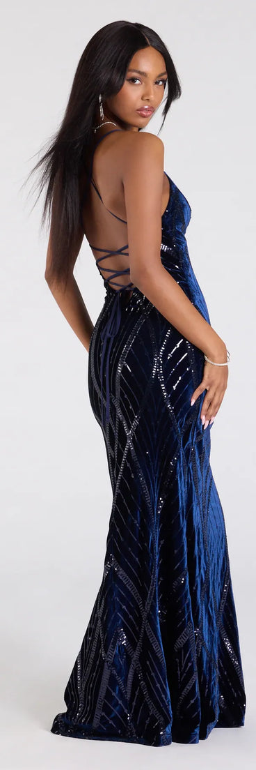Step into the Prom 2026 dance in the Gisele Sequin Velvet Lace-Up Mermaid Dress in navy, a stunning blue prom dress designed to complement any theme with its timeless allure and statement-making style.