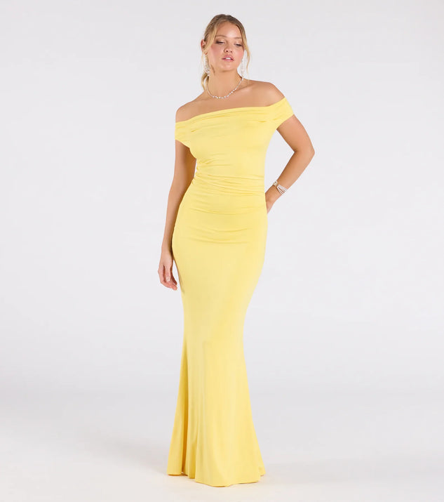 Make a bold statement in the Teagan Sleeveless Cowl Neck Slim Formal Dress in yellow, the perfect spring dress for weddings, cocktail hours, nights out, and/or seasonal celebrations.
