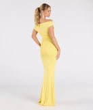 Make a bold statement in the Teagan Sleeveless Cowl Neck Slim Formal Dress in yellow, the perfect spring dress for weddings, cocktail hours, nights out, and/or seasonal celebrations.