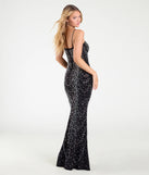 The Clara Rhinestone Pearl Mermaid Formal Dress is a show-stopping black prom dress, offering a sleek, slimming silhouette that enhances your natural beauty for an unforgettable night.