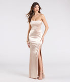 Make a bold statement in the Paula Satin Strapless High Slit Mermaid Dress in gold, the perfect spring dress for weddings, cocktail hours, nights out, and/or seasonal celebrations.