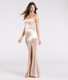 Make a bold statement in the Paula Satin Strapless High Slit Mermaid Dress in gold, the perfect spring dress for weddings, cocktail hours, nights out, and/or seasonal celebrations.