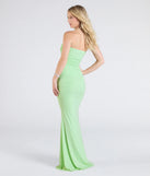 The Mischka Strapless Mermaid Glitter Formal Dress in lime is a stunning green prom dress designed to capture attention with its fresh or bold color and effortlessly stylish silhouette.