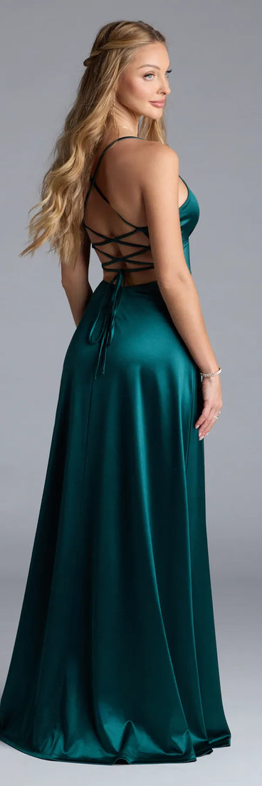 Turn heads at Prom 2025 in this hunter green prom dress, where statement-making details meet the iconic style of the Allegra Lace-Up Slit A-Line Satin Formal Dress.